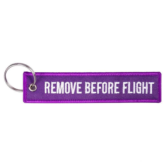 LLAVERO REMOVE BEFORE FLIGHT MORADO