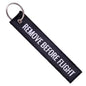 LLAVERO REMOVE BEFORE FLIGHT NEGRO